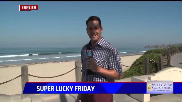 Reporter at beach for Super Lucky Friday segment.