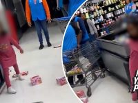 Child throwing food boxes in store aisle.