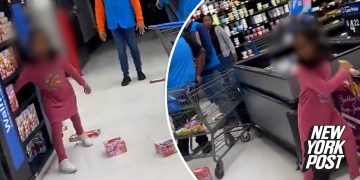 Child throwing food boxes in store aisle.