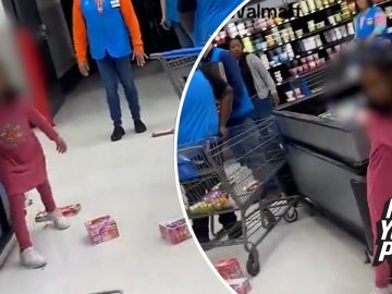 Child throwing food boxes in store aisle.