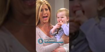 Woman holding laughing baby