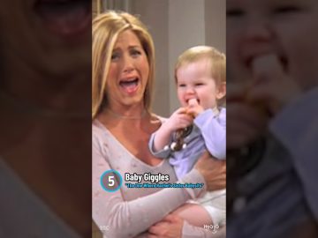Woman holding laughing baby