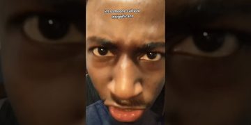Man's face with intense expression and text overlay.