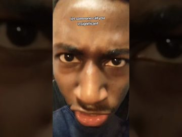 Man's face with intense expression and text overlay.