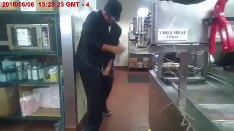 Person working in commercial kitchen spills liquid