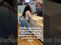 Woman and employee discussing work issue at McDonald's.