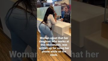 Woman and employee discussing work issue at McDonald's.
