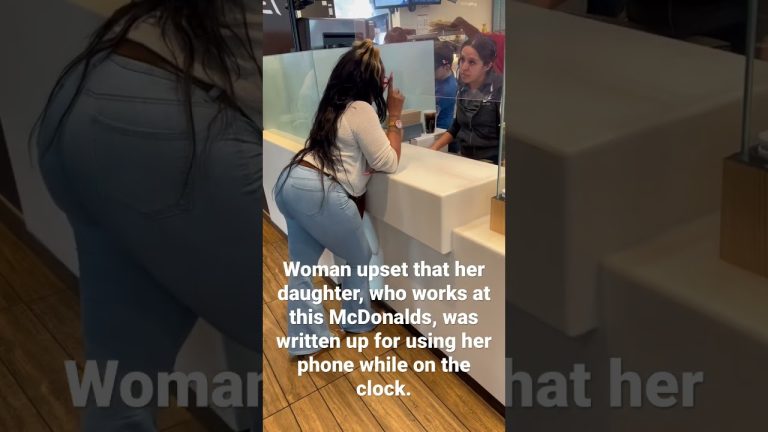 Woman and employee discussing work issue at McDonald's.