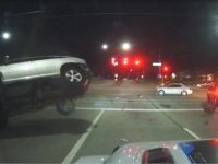 Car collision at night intersection, vehicle flipping over.