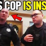 Two police officers in a building.