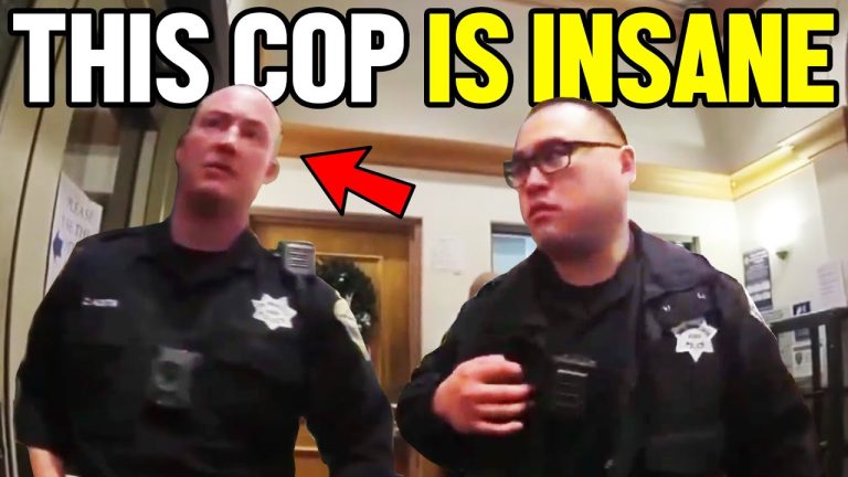 Two police officers in a building.