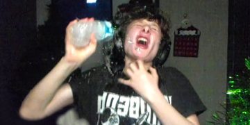 Person splashing water on face joyfully