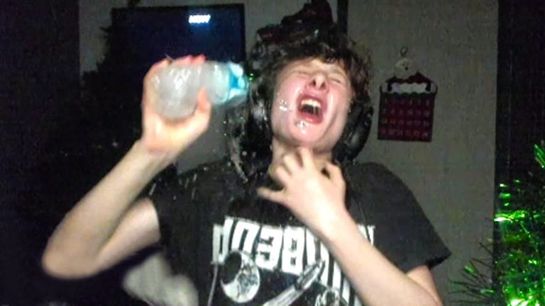Person splashing water on face joyfully