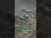 Police car driving off-road towards Rosamont Avenue.