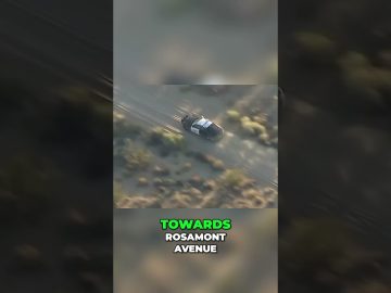Police car driving off-road towards Rosamont Avenue.