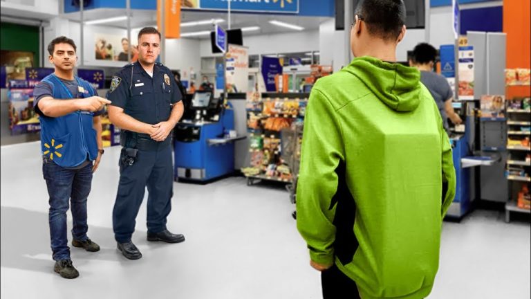 Store employee and officer confront customer in green hoodie.