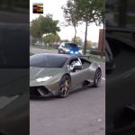 Green sports car followed by police vehicle.