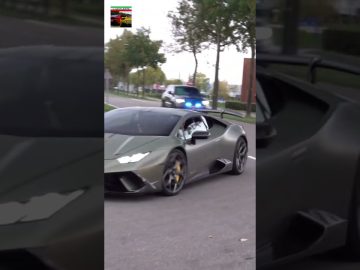 Green sports car followed by police vehicle.