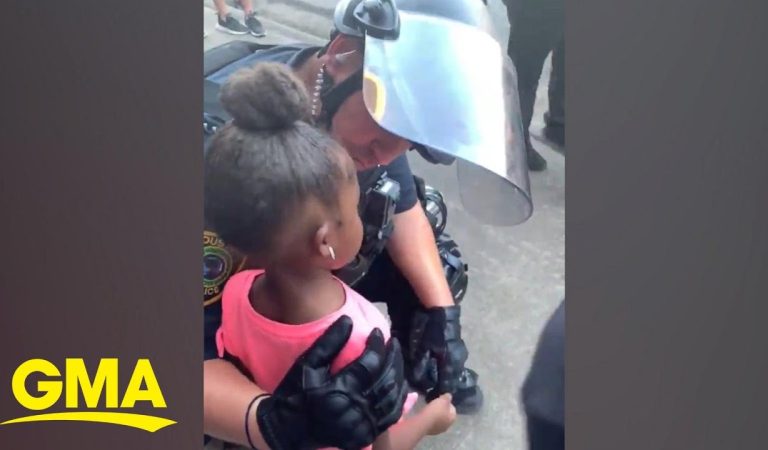 Police officer comforts little girl after she asks: ‘Are you going to shoot us?’ l GMA Digital