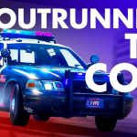 Police car in pursuit with flashing lights