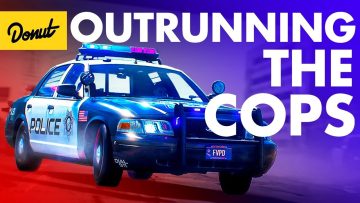 Police car in pursuit with flashing lights