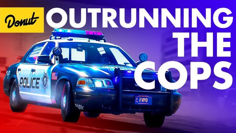 Police car in pursuit with flashing lights