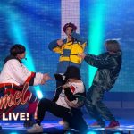 Group performing on Jimmy Kimmel Live stage