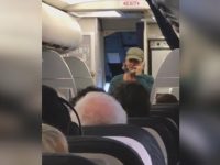 Person speaking on phone during flight.