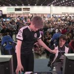 Esports event with gamers and audience.