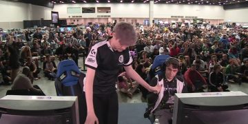 Esports event with gamers and audience.