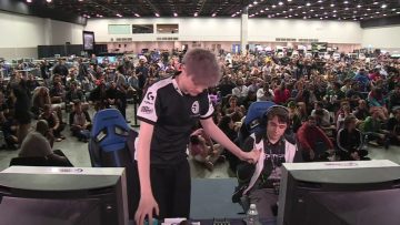 Esports event with gamers and audience.