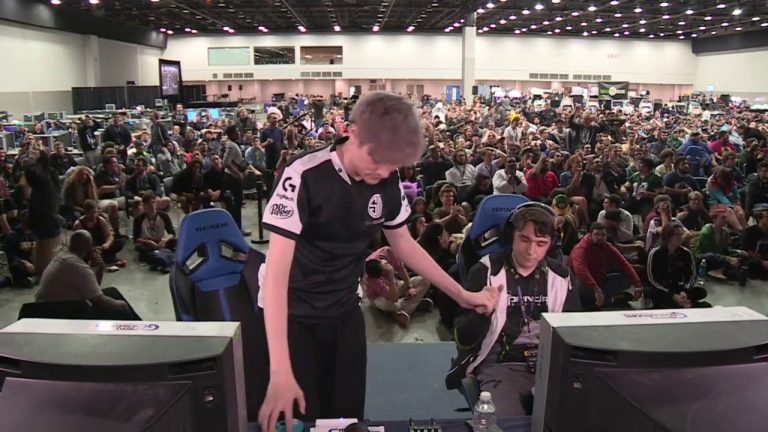 Esports event with gamers and audience.