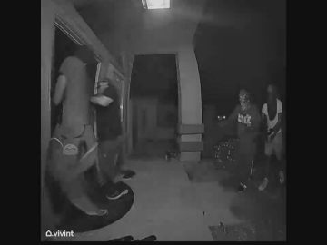 Nighttime door camera footage of attempted break-in.