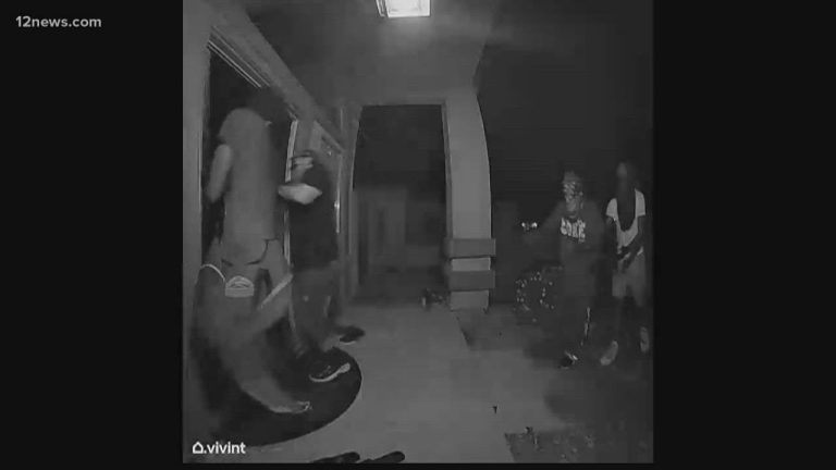 Nighttime door camera footage of attempted break-in.