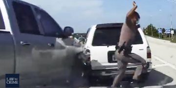 Highway collision involving police officer and vehicles.