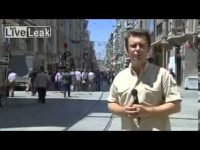 Reporter on busy city street with microphone