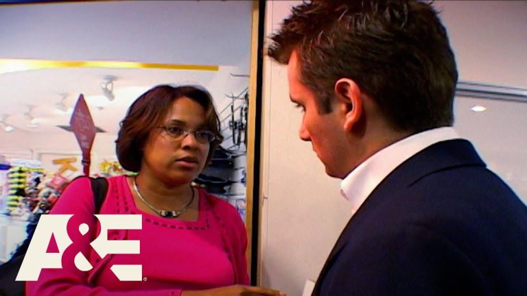 Two people talking in a store setting.