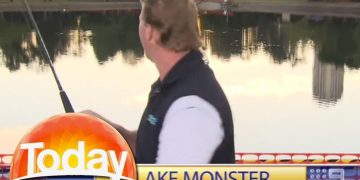 Reporter fishing in lake during news segment.