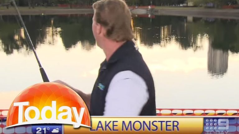 Reporter fishing in lake during news segment.