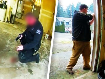 Police officer kneeling with gun inside garage.