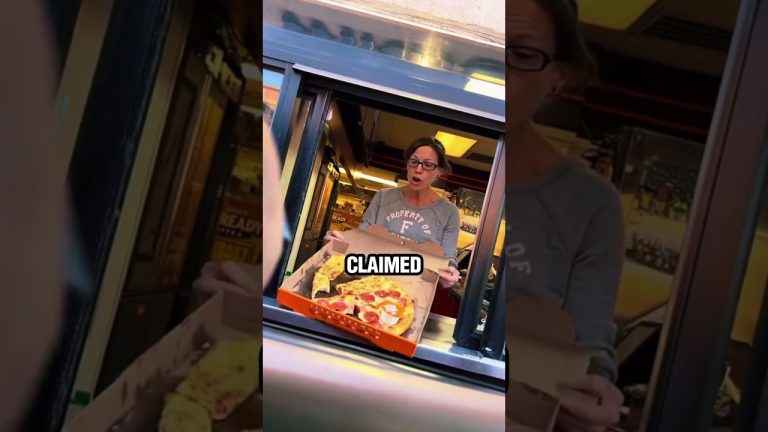 Woman surprised holding takeaway pizza box in drive-thru.
