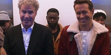 People smiling inside an elevator