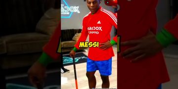 Person in red soccer jersey with 'Messi' text.