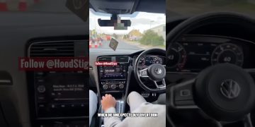 Driving Volkswagen car on city road, unexpected overtake.