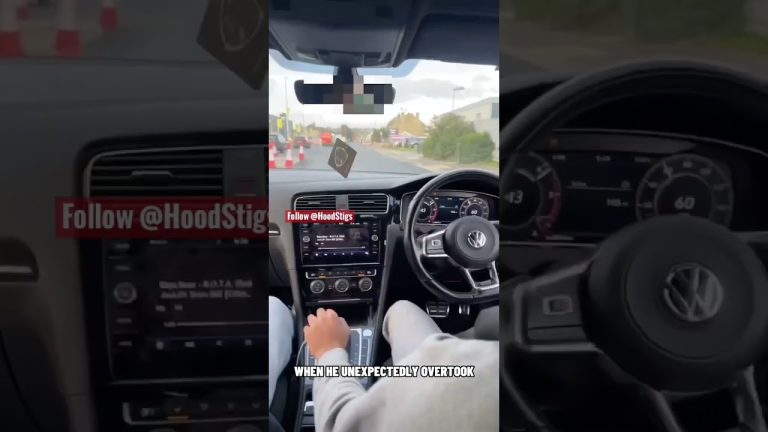 Driving Volkswagen car on city road, unexpected overtake.
