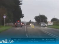 Cars on Truro Road in rainy weather conditions.