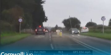 Cars on Truro Road in rainy weather conditions.