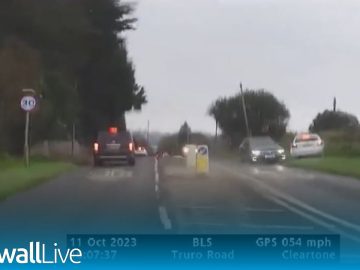 Cars on Truro Road in rainy weather conditions.