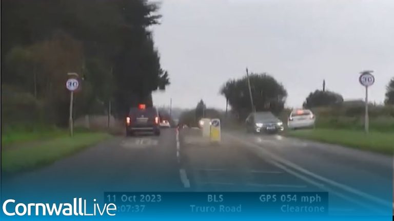 Cars on Truro Road in rainy weather conditions.
