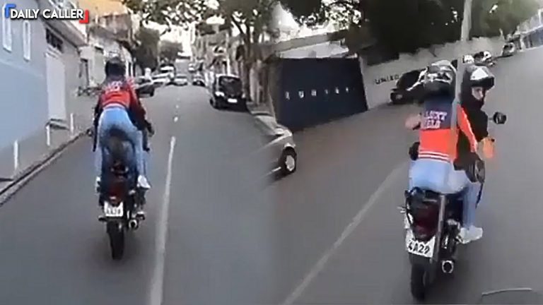 Delivery riders driving on urban road.